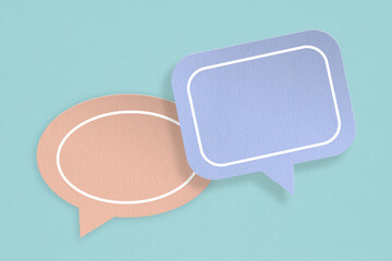 For conceptual image about communication and social media, customer feedback, Blank correspondence orange and blue grunge paper speech bubbles with quote sign on rough  green paper background