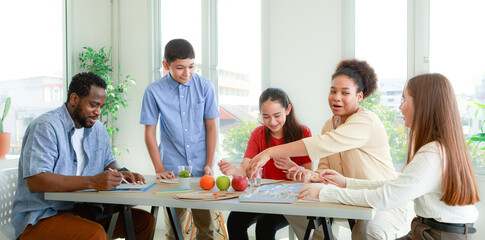 male and female students and African teachers Doing drawing and painting activities