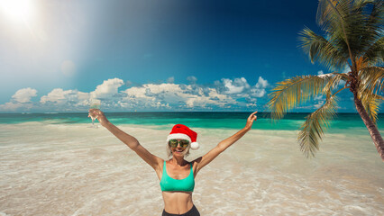 Young woman in santas hat relaxing tropical sand beach christmas sunny day