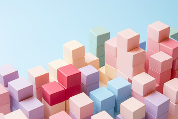 Toy building bricks on pastel background