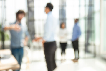 Blurred image of business people standing in the office