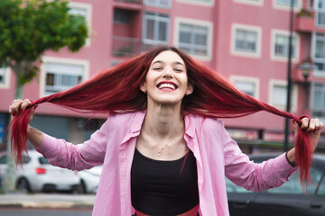 girl on the street with long red hair on the street