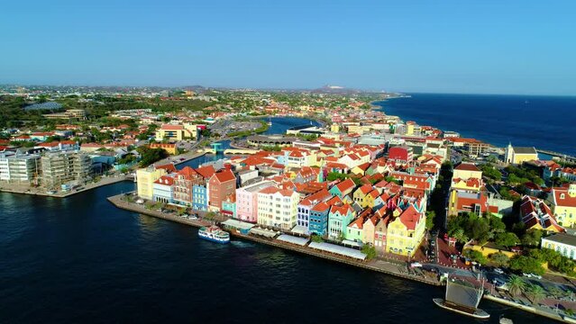 Willemstad Curacao, vibrant brightly colored buildings along canal, drone wide angle