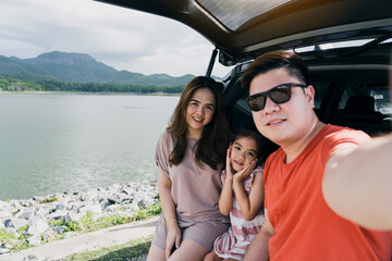 Summer break Happy family having fun while taking a selfie camera. The concept of family on vacation and travel.