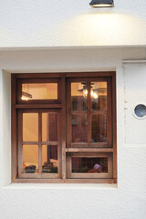 summer street photography - wooden windows on a white wall