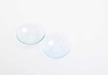 Contact lenses, or simply contacts on white background