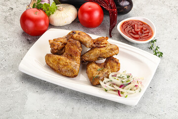 Grilled chicken wings with sauce