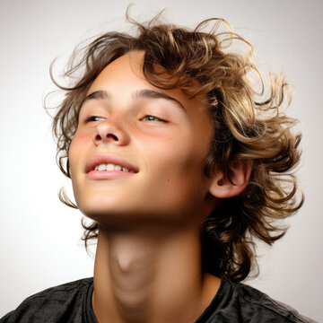 A professional studio head shot capturing the whimsical daydreaming of a 15-year-old Lebanese boy.