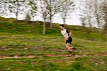 Young man running in the mountains