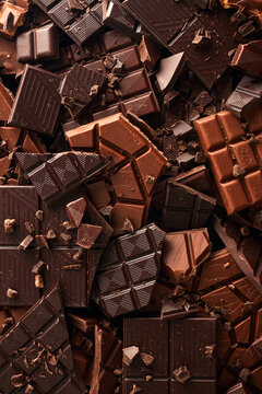Broken chocolate bar texture background	
