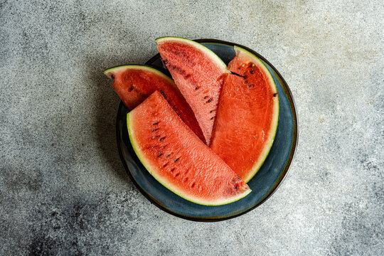 Overhead view of slices of red watermelon on a plate