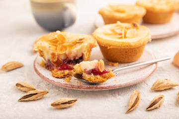 Traditional portuguese cakes pasteis de nata, custard small pies on gray concrete. Side view, selective focus.