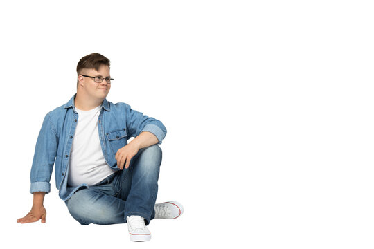PNG,smiling young man with down syndrome in glasses, jeans and white t-shirt posing for camera,isolated on white background