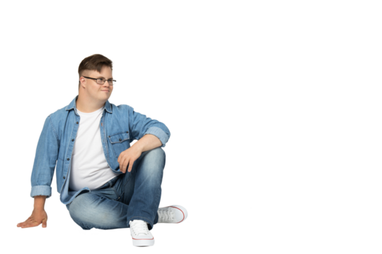 PNG,smiling young man with down syndrome in glasses, jeans and white t-shirt posing for camera,isolated on white background