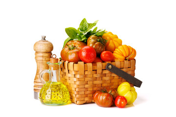 Assorted tomatoes in rustic basket