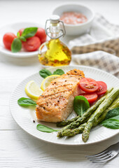 Baked Delicious salmon, green asparagus on  plate