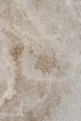 Rough stone texture with a light brown hue, background for design