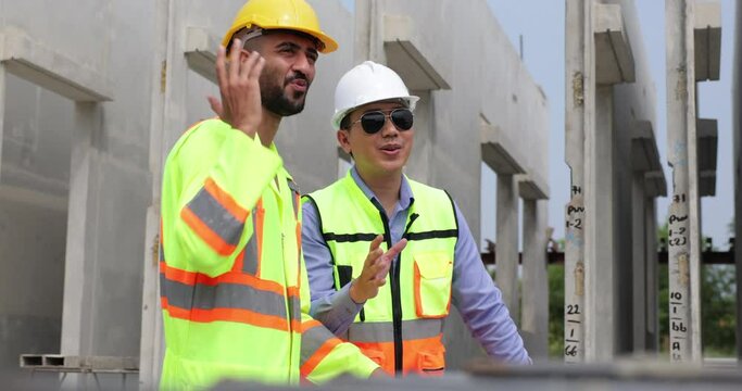 building and construction worker, Hiapanic latin and asian male in safety hard hat helmet working on steel wire mesh for concrete slab reinforcement at Prefabricated concrete walls Manufacturing