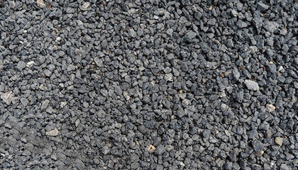 Gray small rocks ground texture. black small road stone background. gravel pebbles stone seamless...