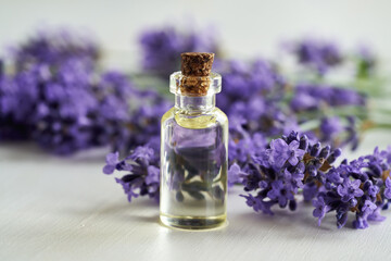 Lavender essential oil on a white table