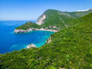 Fototapeta na wymiar Queen's Beach ( Kraljichina Beach ) in Canj, Montenegro. Aerial view of paradise tropical beach, surrounded by green hills. Montenegro. Balkans. Europe.