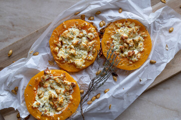 Low carb meal with baked butternut squash, feta cheese and roasted pumpkin seeds