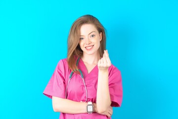 Young caucasian doctor woman wearing medical uniform  Beckoning come here gesture with hand inviting welcoming happy and smiling