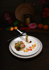 smoked peking duck slice with fresh vegetables salad appetiser fine dining cuisine halal food banquet restaurant menu on dark background
