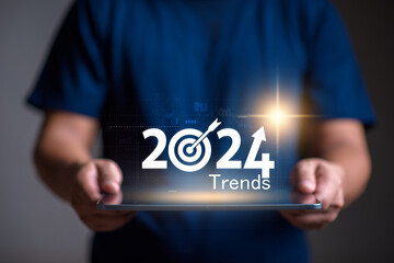 Trends for 2024 concept, Businessman show 2024 trends  for marketing monitor and business planing in new year concept. marketing trends, Design trends, global trends.