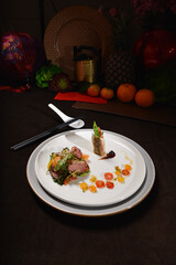smoked peking duck slice with fresh vegetables salad appetiser fine dining cuisine halal food banquet restaurant menu on dark background