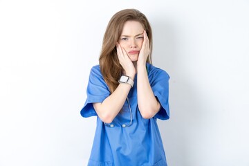 Young caucasian doctor woman wearing medical uniform Tired hands covering face, depression and sadness, upset and irritated for problem