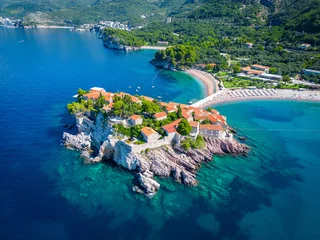 Fotobehang Island of Sveti Stefan near Budva in Montenegro. Beaches and coastline of the Adriatic Sea at summer time. Natural landscapes of Montenegro. Balkans. Europe. © Curioso.Photography