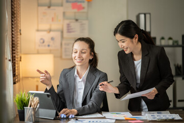 Asian businessmen, women and men Talk about new projects, presents at home office.