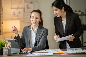 Asian businessmen, women and men Talk about new projects, presents at home office.
