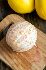 Juicy orange while cooking on the table