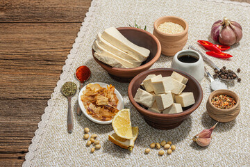 Set of ingredients for preparation Tofu. Fresh diced cheese, spices, herbs and soy sauce