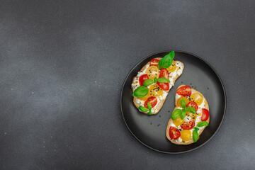 Fresh bread sandwiches with tomato cherry, cream cheese and basil leaves. Morning breakfast concept