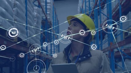Animation of network of digital icons over caucasian female supervisor using tablet at warehouse - Powered by Adobe