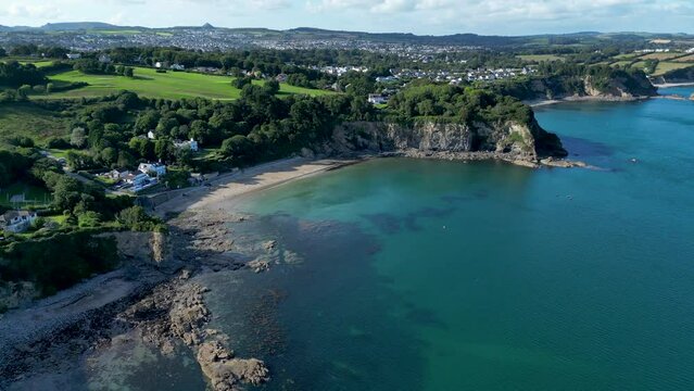 4K: Aerial Drone Video of the Cornwall Coastline, England, UK. Flying around a beach near St. Austell in a circle. Stock Video Clip Footage
