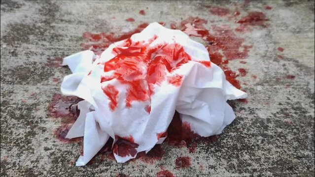 blood spills on the floor and tissues. Concept photo illustration of vomiting blood and Health medical treatment.