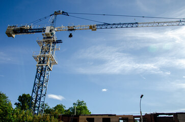 Large metal construction crane against the sky