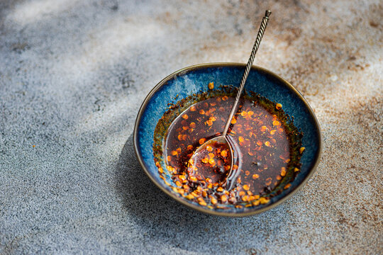 Bowl with red hot chilli pepper oil