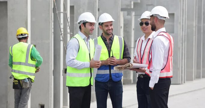 Ethnic diversity worker people. Success teamwork. Group of professional Construction engineering people wearing hardhat safety helmet meeting at Prefabricated concrete walls Industry 