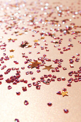 Shimmer golden stars and crystals confetti. Selective focus.