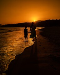 silhouette of a person on the pier at sunset