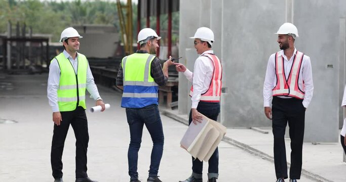 Ethnic diversity worker people. Success teamwork. Group of professional Construction engineering people wearing hardhat safety helmet meeting at Prefabricated concrete walls Industry 