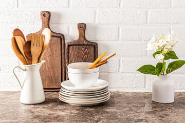 Fototapeta na wymiar Beautiful kitchen utensils made of natural materials on a modern wooden countertop. Eco-friendly kitchen without waste and plastic.