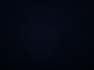 Dark rough cement wall background for graphic design or wallpaper.