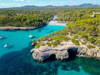 Aerial view of floating boats in Cala Llombards