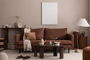 Interior design of cozy living room interior with mock up poster frame, brown sofa, wooden coffee...